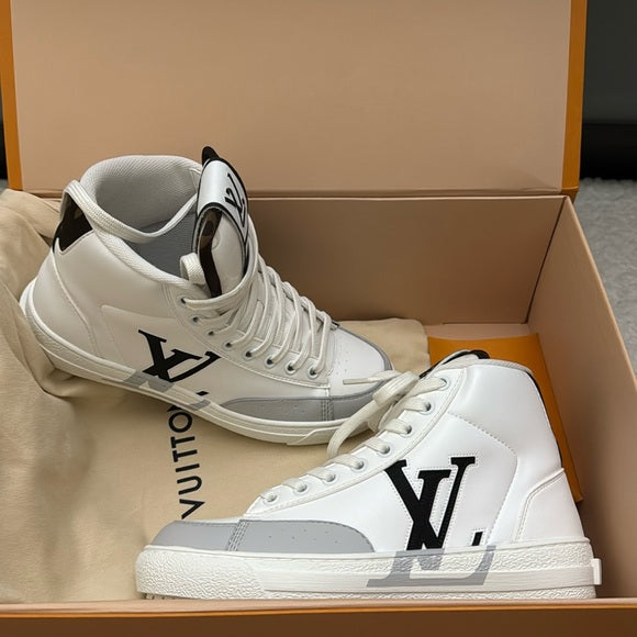 Louis Vuitton Charlie high-top sneaker in white leather with a grey toe cap and black accents.