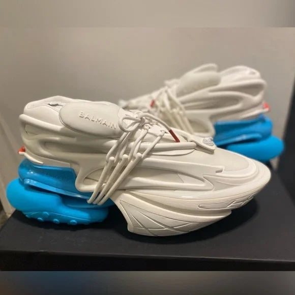 Balmain Unicorn low-top sneakers in white and blue, known for their distinctively bold, architectural design and unique sole structure.