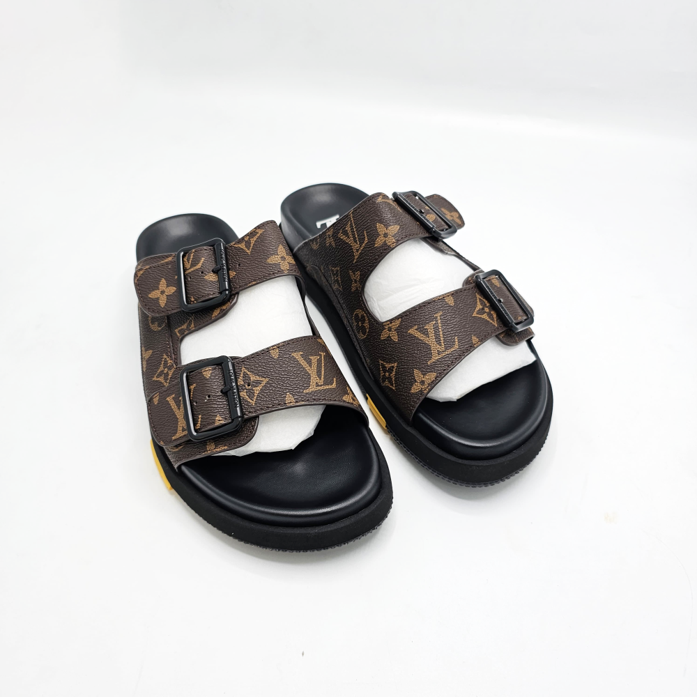 Louis Vuitton Lock It Flat Mules.