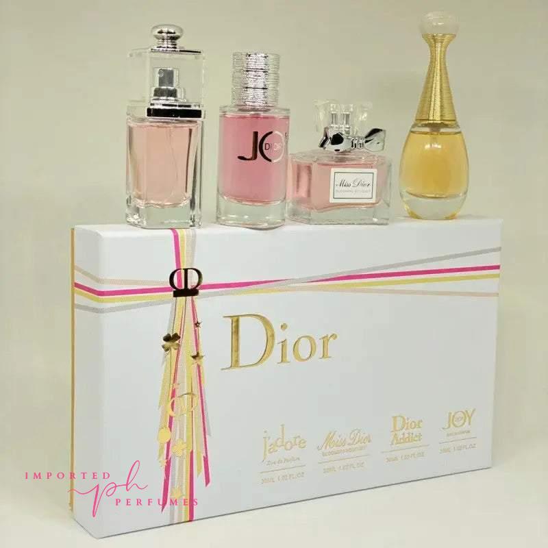 Dior perfume gift set for women featuring miniature bottles of J'adore, Miss Dior, and Dior Addict fragrances.